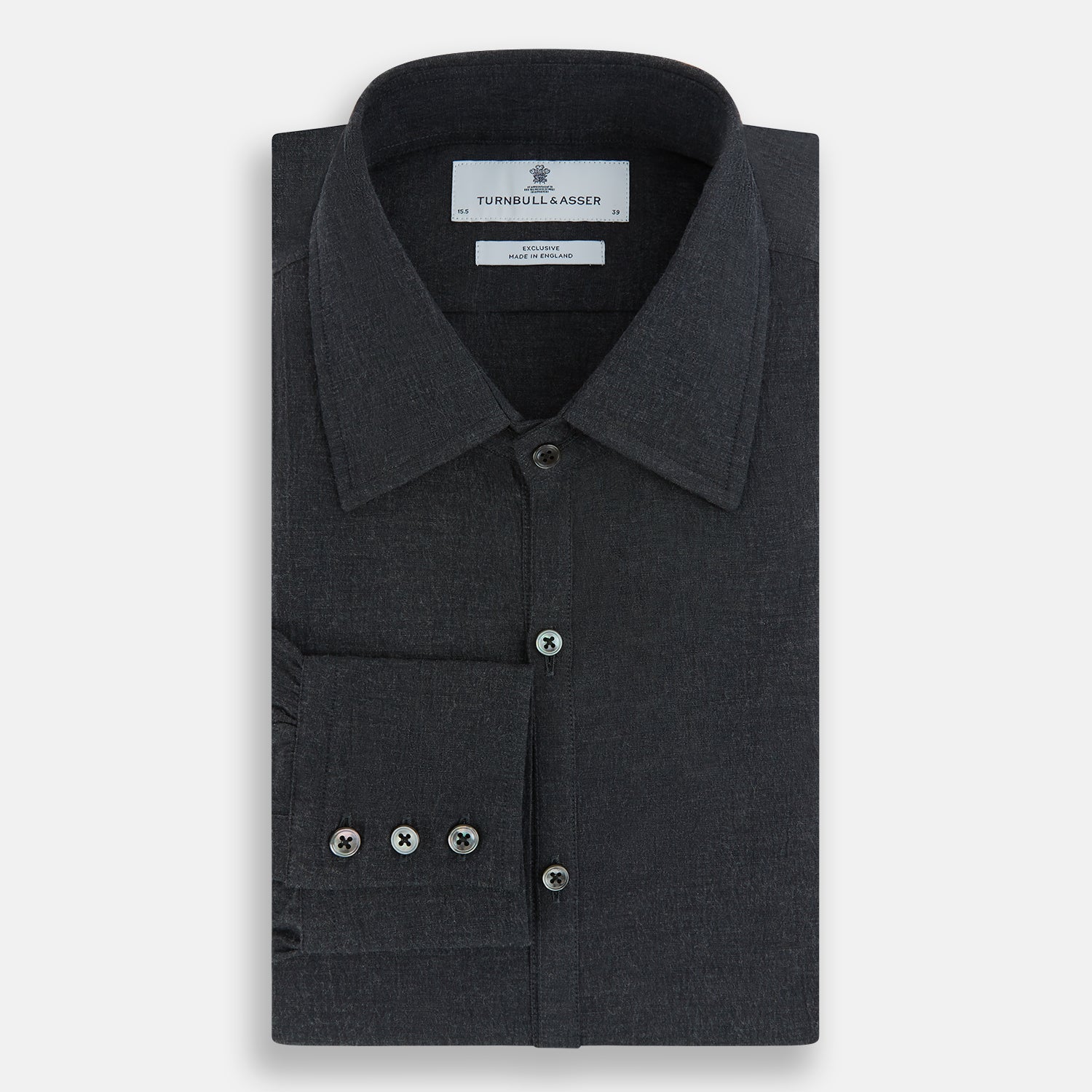 View 5 of product The Turnbull & Asser Midnight Blue Westminster Shirt features long sleeves, a button-up front, classic collar, and buttoned cuffs in a plain design—showcasing British craftsmanship—laid flat on a white background.