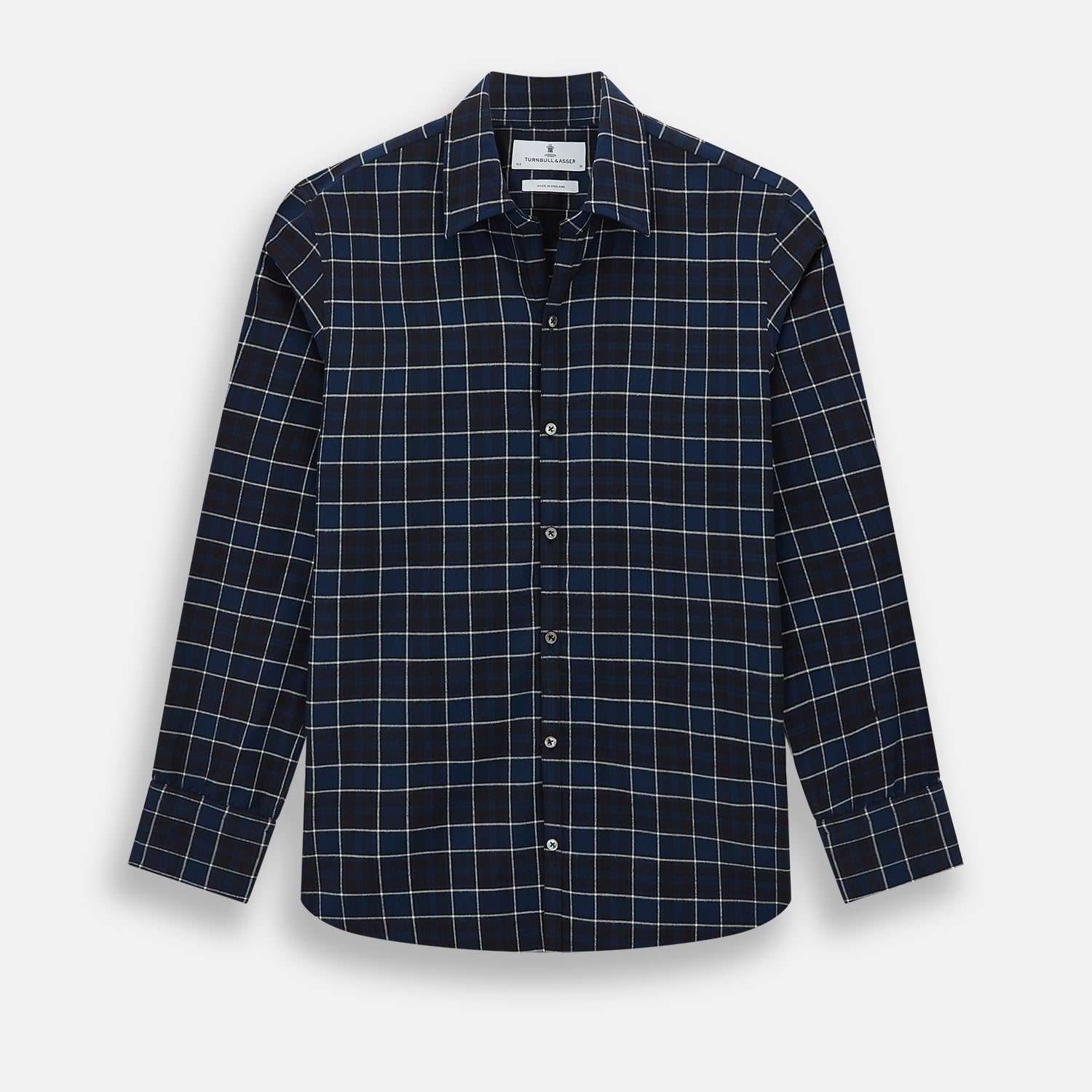 View 1 of product The Turnbull & Asser Navy and White Check Windsor Shirt features a long-sleeve design with a navy base and white check pattern, showcasing British craftsmanship and displayed on a white background.