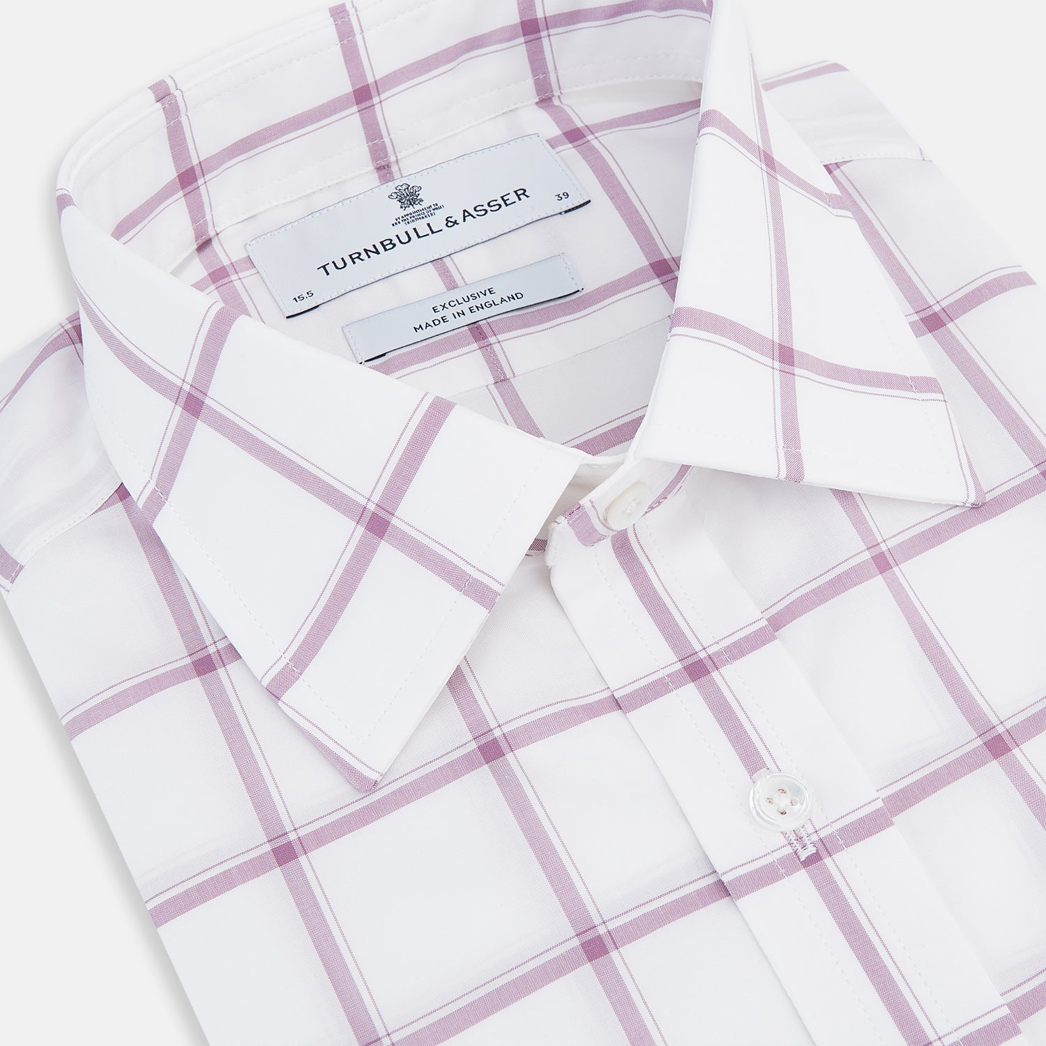 View 2 of product The Antique Pink Grid Check Mayfair Shirt by Turnbull & Asser is a long-sleeve shirt made from Italian cotton, featuring evenly spaced pink grid checks, displayed flat on a white background.