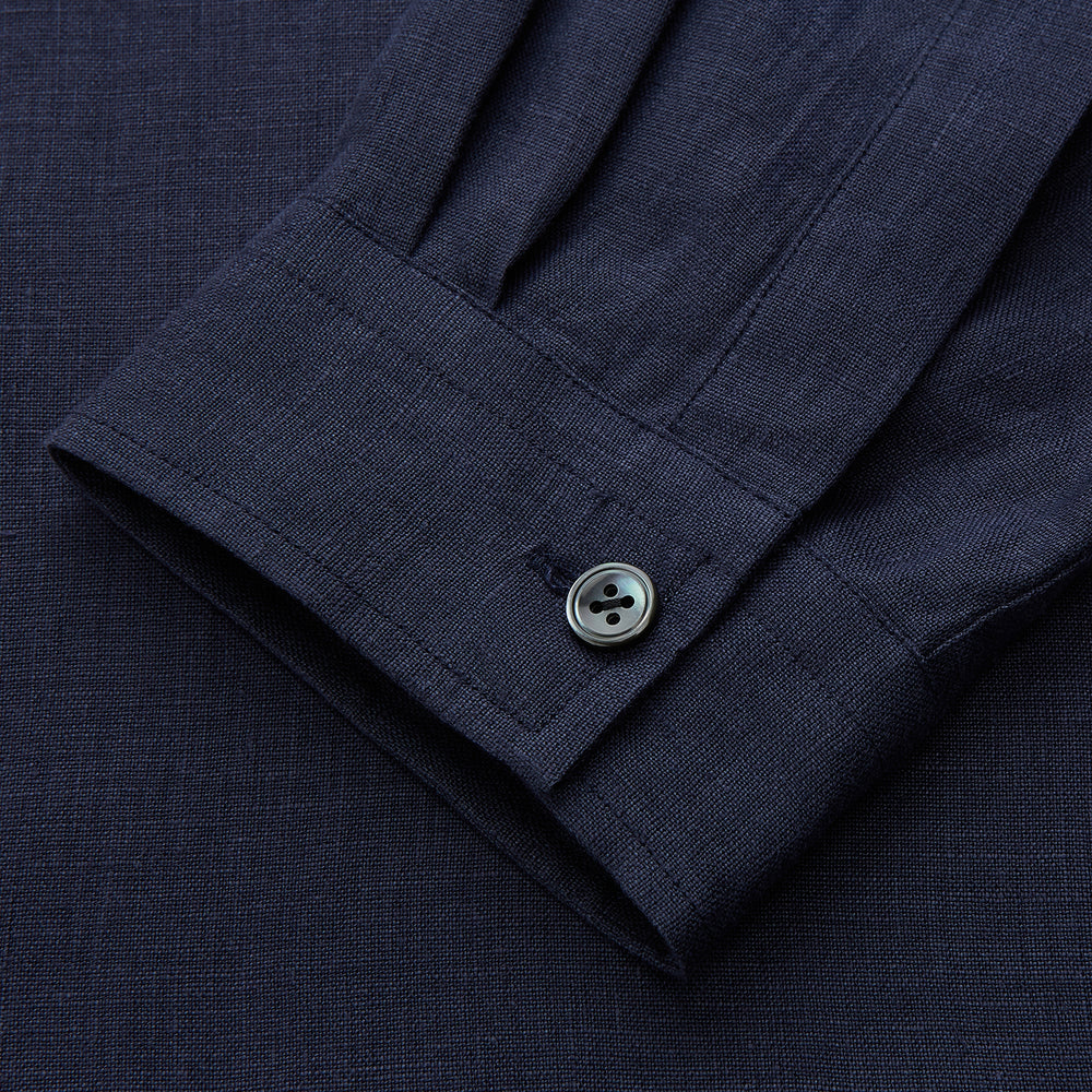 The Turnbull & Asser Navy Hemp Holiday Fit Winnington Shirt is a long-sleeve, button-up shirt with a single chest pocket, shown laid flat on a white background.