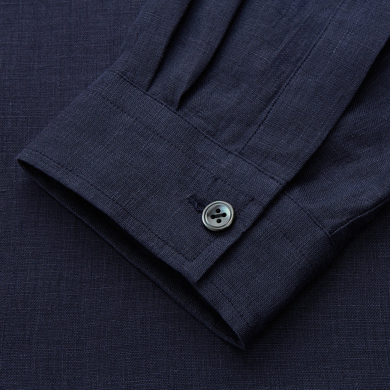 View 3 of product The Turnbull & Asser Navy Hemp Holiday Fit Winnington Shirt is a long-sleeve, button-up shirt with a single chest pocket, shown laid flat on a white background.