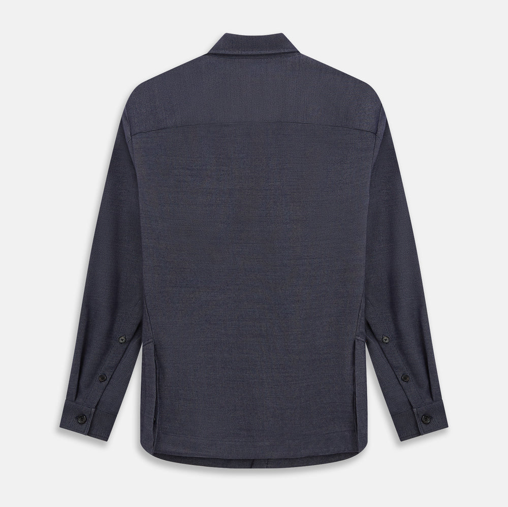 The Turnbull & Asser Navy Hampstead Overshirt features a collar, left chest pocket, two zippered pockets near the bottom, and a classic long-sleeve button-up design, shown laid flat on a white background.