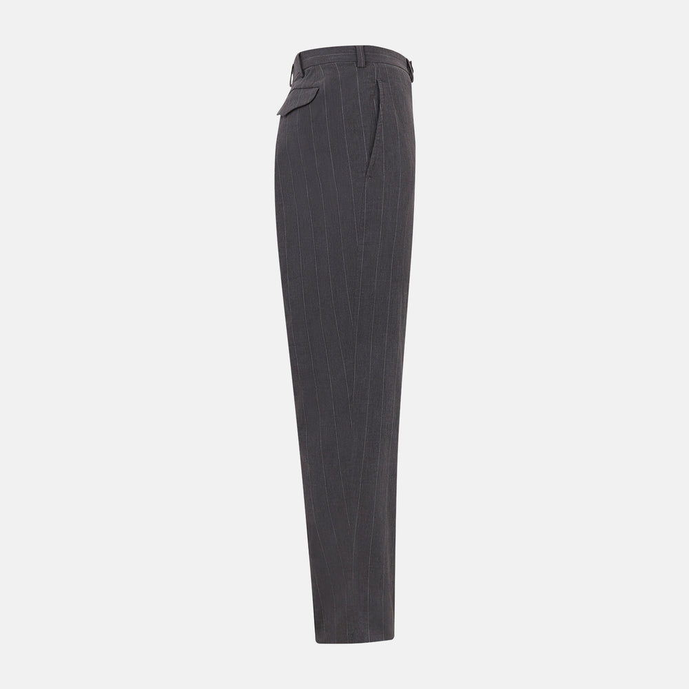Turnbull & Asser’s Dark Chocolate Striped Edmund trousers feature straight-cut legs, a relaxed fit, button closure, and belt loops. These cotton trousers display subtle vertical stripes against a plain white background.