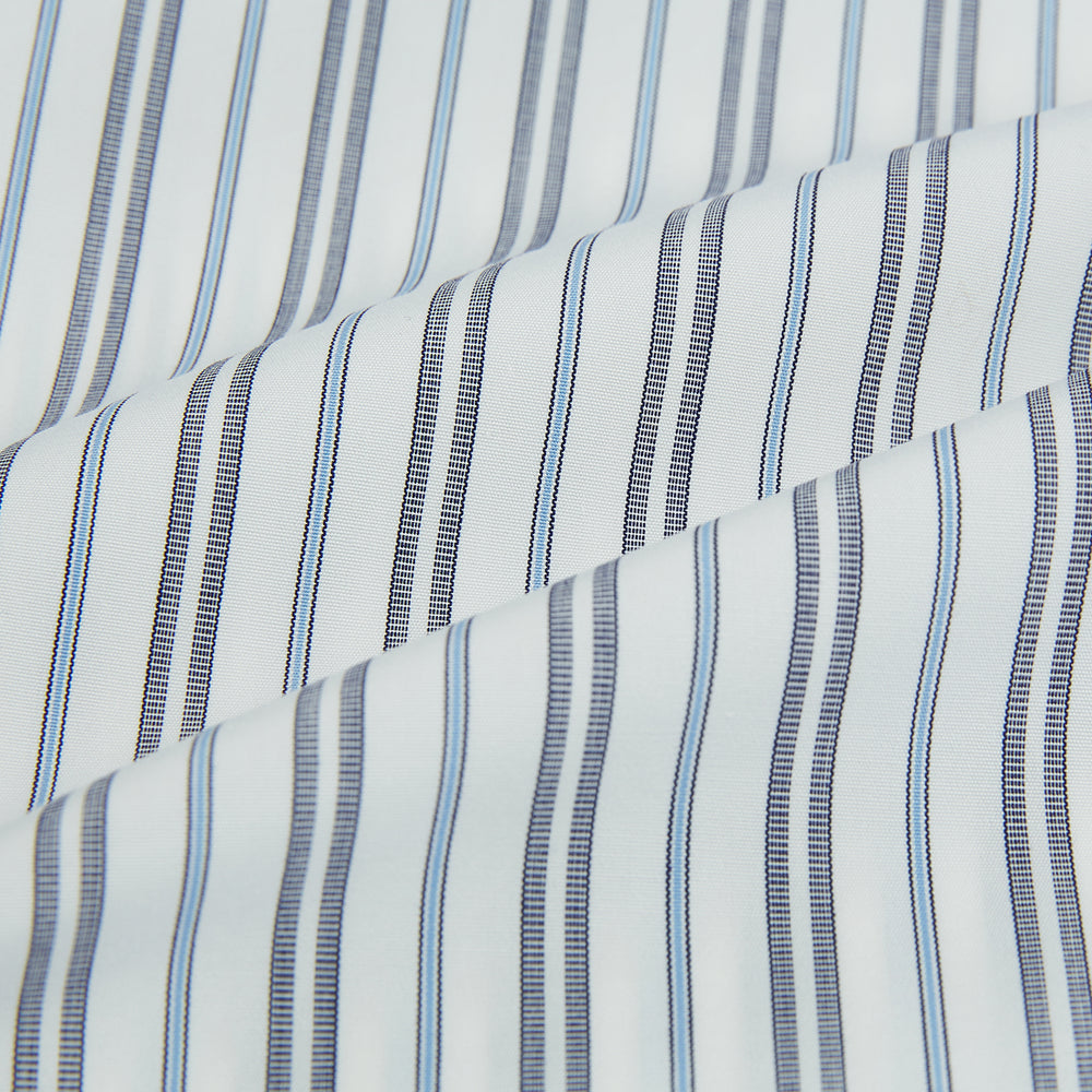 The Turnbull & Asser Navy and Light Blue Multi Track Stripe Westminster Shirt, featuring a button-up design with long sleeves and a signature collar, is displayed flat to highlight its expert British craftsmanship.