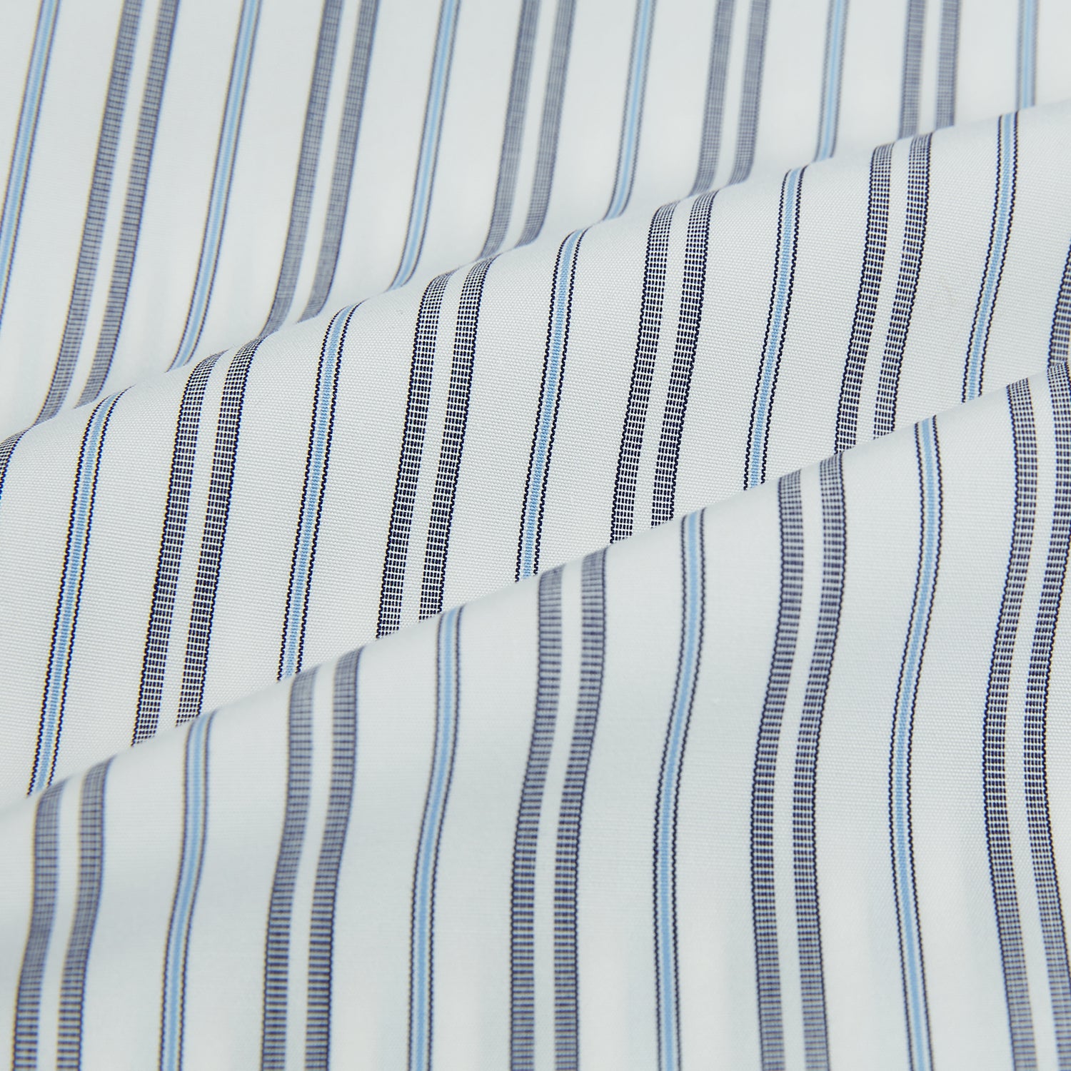 View 8 of product The Turnbull & Asser Navy and Light Blue Multi Track Stripe Westminster Shirt, featuring a button-up design with long sleeves and a signature collar, is displayed flat to highlight its expert British craftsmanship.