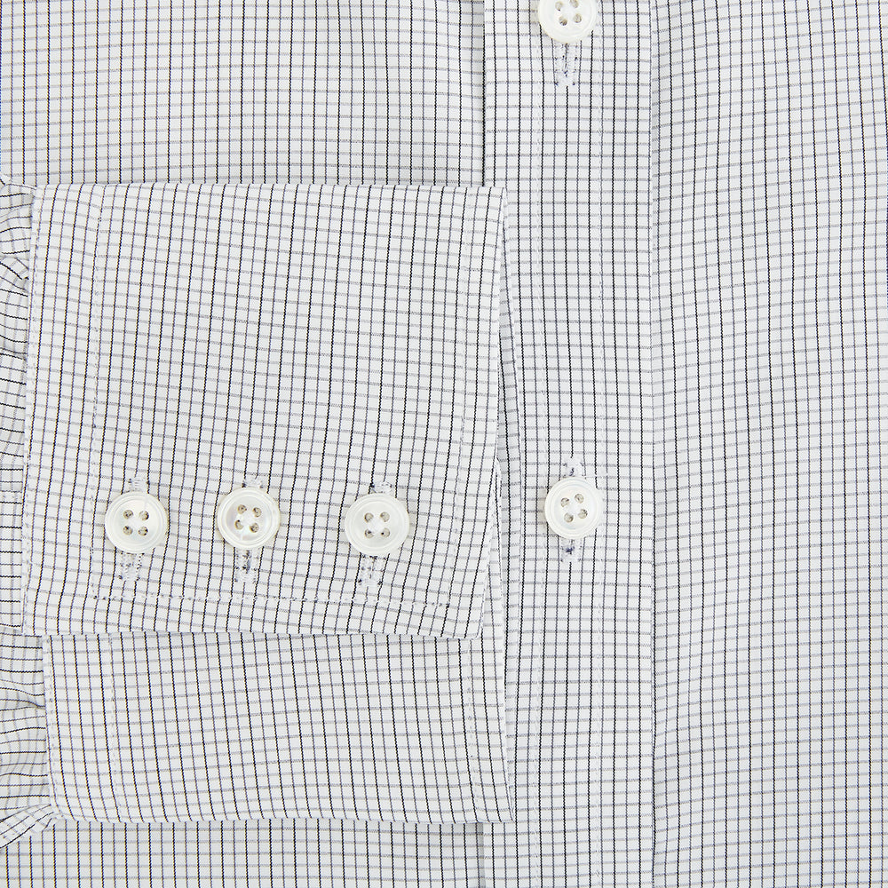 A tailored-fit Turnbull & Asser Mayfair Shirt in midnight blue with a grid check pattern, spread collar, and buttoned cuffs, crafted from premium Italian cotton and laid flat on a white background.