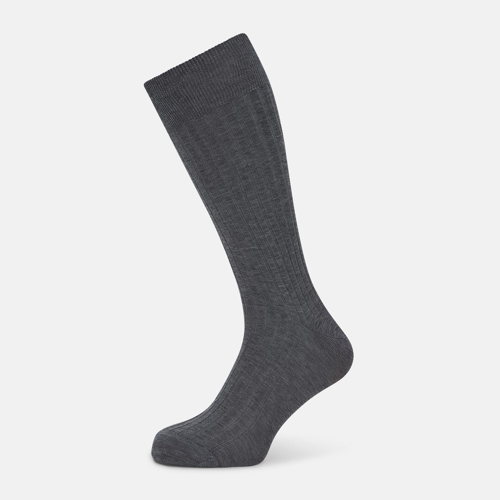 The Ash Mid-Length Sock by Turnbull & Asser, shown upright on a plain white background, is a single dark gray ribbed knee-high made from mercerised Egyptian cotton.