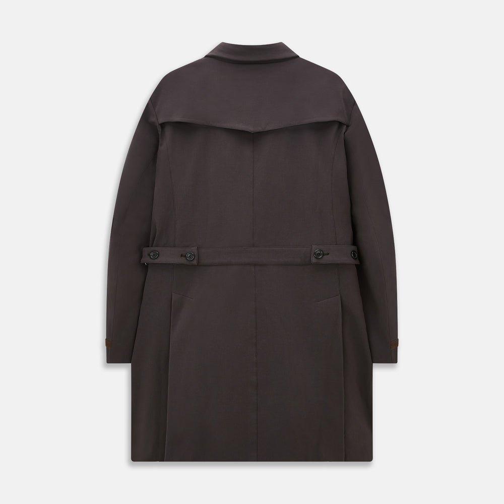 The Dark Chocolate John Arthur Trench Coat by Turnbull & Asser features a pointed collar, two large slanted side pockets, and a vertical chest pocket—a versatile 2-in-1 piece ideal for any occasion.