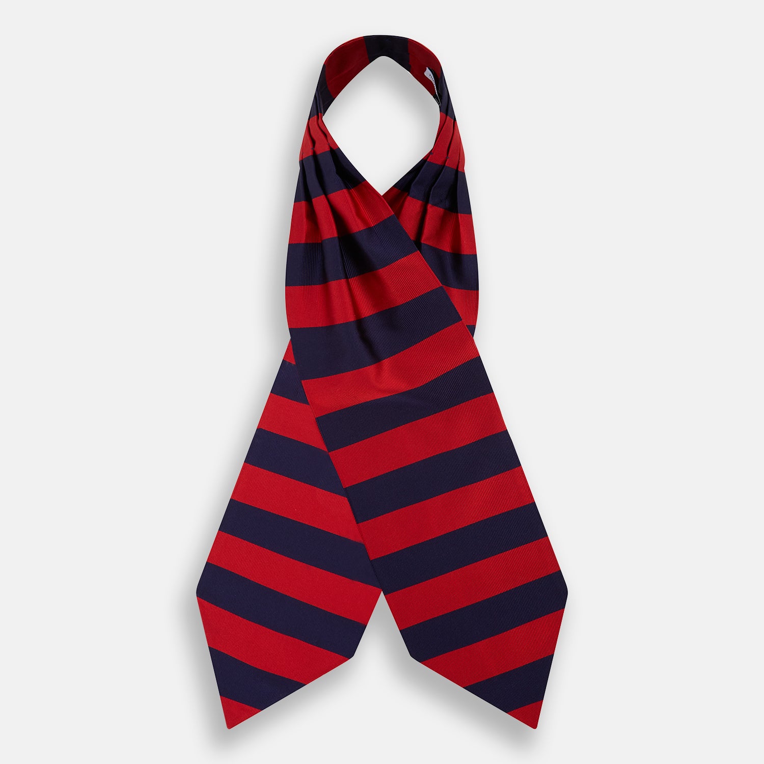 View 2 of product The Turnbull & Asser Wide Red Stripe and Navy Silk Cravat features bold diagonal stripes, adding a refined touch of British elegance to any ensemble.