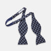 View 3 of product The Turnbull & Asser Navy and Blue Houndstooth Wool Blend Bow Tie features a self-tying design with a blue and black houndstooth pattern, showcased on a plain white background.