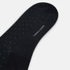 View 3 of product A single Navy/Pale Blue Polka Dot Long Sock by Turnbull & Asser, made from mercerised Egyptian cotton, is displayed against a plain white background.