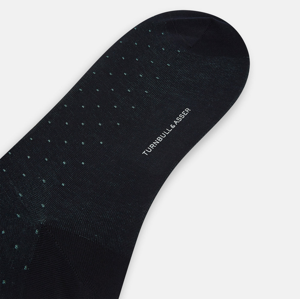 A single Navy/Pale Blue Polka Dot Long Sock by Turnbull & Asser, made from mercerised Egyptian cotton, is displayed against a plain white background.