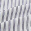 View 5 of product The Turnbull & Asser Purple Multi Stripe Quarzo Nightshirt features a collared, button-front design with a chest pocket and vertical white and light gray stripes, shown laid flat on a white background.