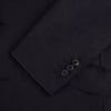 View 7 of product The Turnbull & Asser Long Navy Single Breasted Suit, shown on a white background, features a blazer with notch lapels and matching tailored trousers—ideal for formal occasions.
