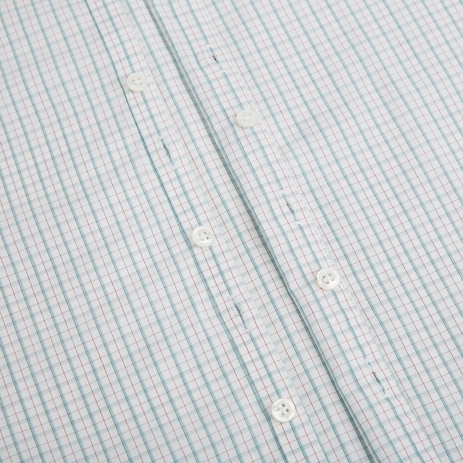 View 7 of product The Turnbull & Asser Turquoise and Red Ticking Stripe Windsor Shirt, featuring a classic collar and buttoned cuffs, is displayed flat against a white background.