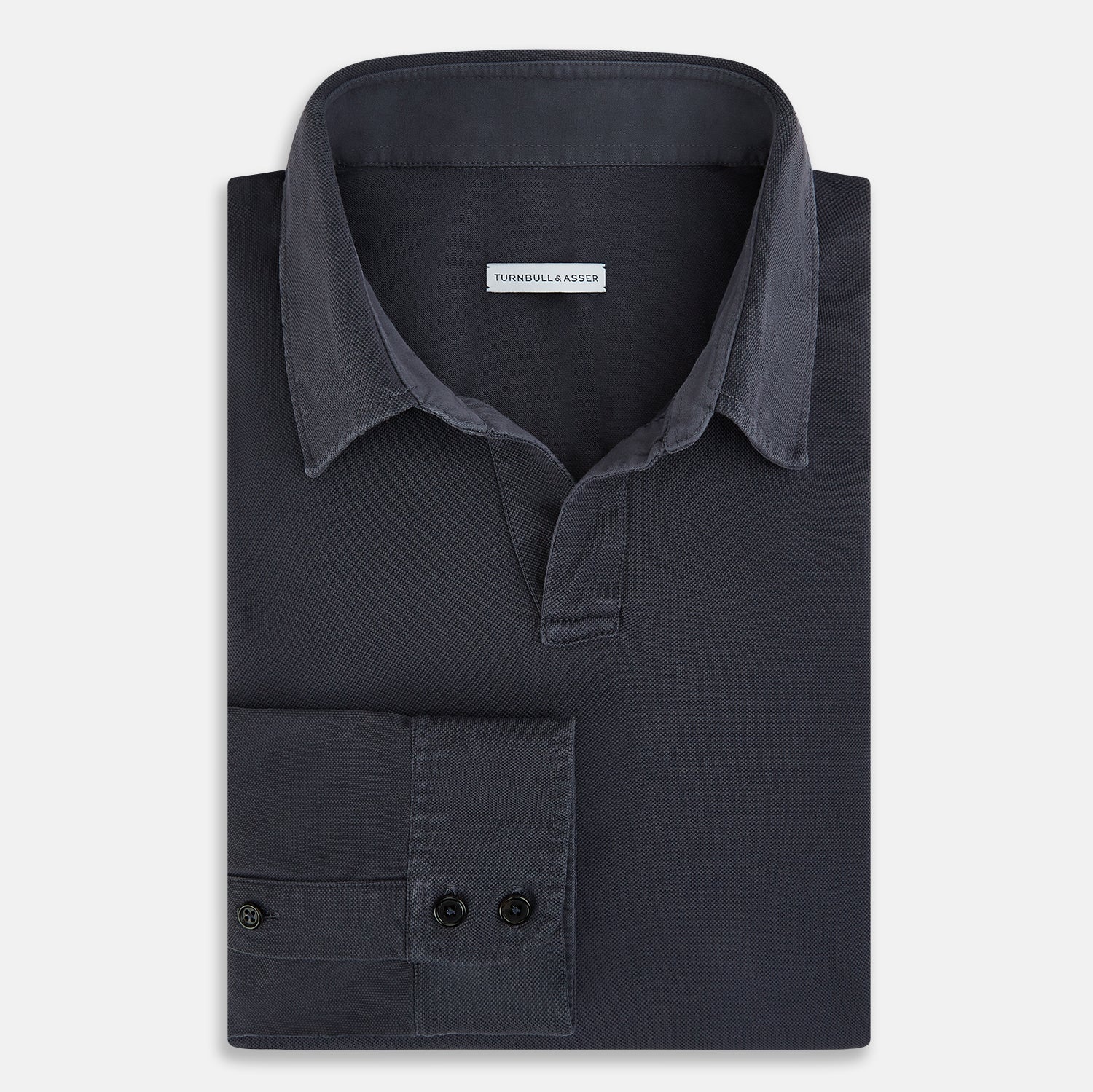View 5 of product The Charcoal Rugby Polo Shirt by Turnbull & Asser is a pure cotton, long-sleeve polo in charcoal grey, featuring a collared open V-neck with no buttons, displayed flat on a white background.