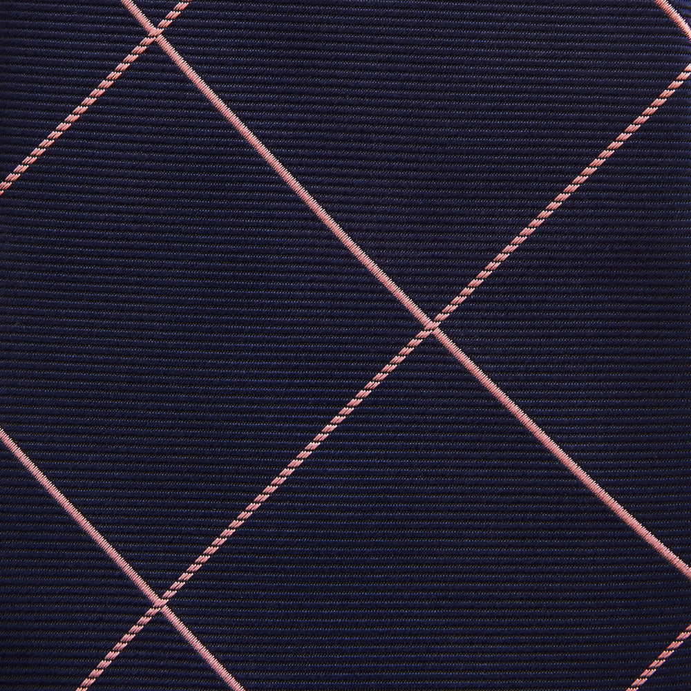 The Turnbull & Asser FONDANT PINK and WINDOW PANE NAVY Silk Tie features a subtle ribbed texture with a pink grid pattern on navy—an elegant choice for polished office attire, shown neatly rolled on a white background.