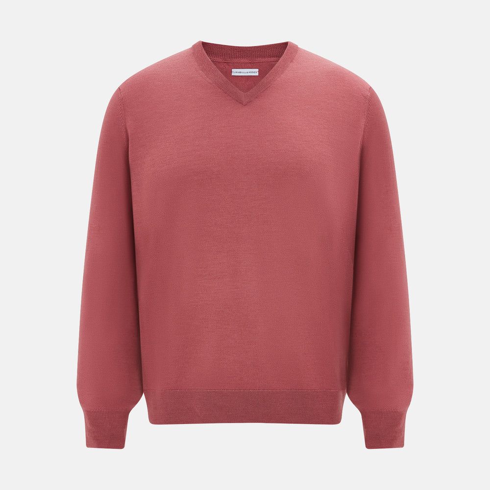 The Turnbull & Asser Antique Pink Merino V-Neck Jumper features ribbed cuffs, hem, and neckline in a soft antique pink, shown on a plain white background. Part of our knitwear collection.