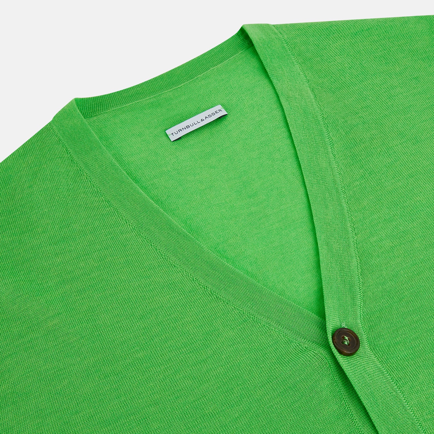 View 2 of product The Turnbull & Asser Lime Green Fine Merino V-Neck Cardigan features long sleeves and dark brown front buttons, shown against a plain white background.