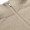View 2 of product The Beige Lennox Half-Zip Jumper by Turnbull & Asser is a stylish cashmere knit with long sleeves, high collar, and half-length front zipper, finished with ribbed cuffs and hem. Shown against a plain white background.