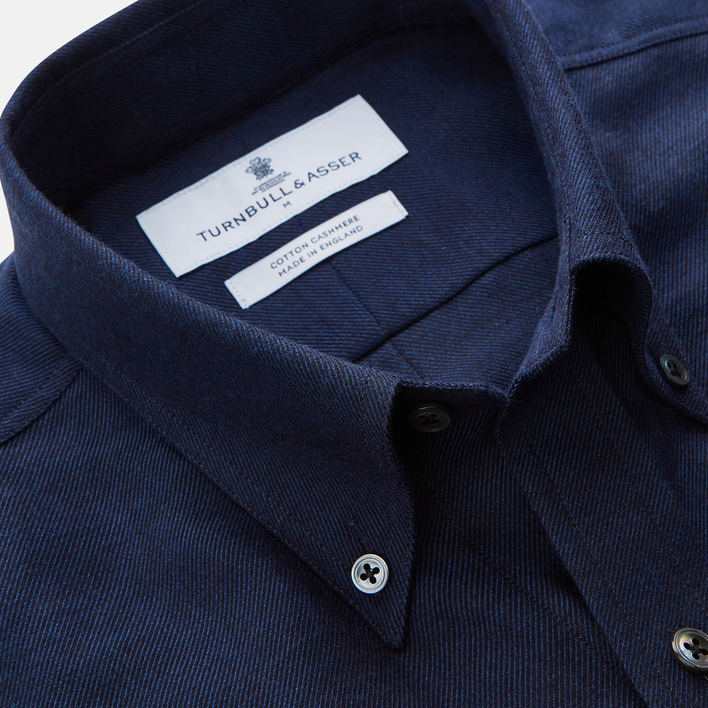 The Turnbull & Asser Navy Weekend Fit Nevis Cotton-Cashmere Shirt features a Dorset collar, 1-button cuffs, and is laid flat on a white background.