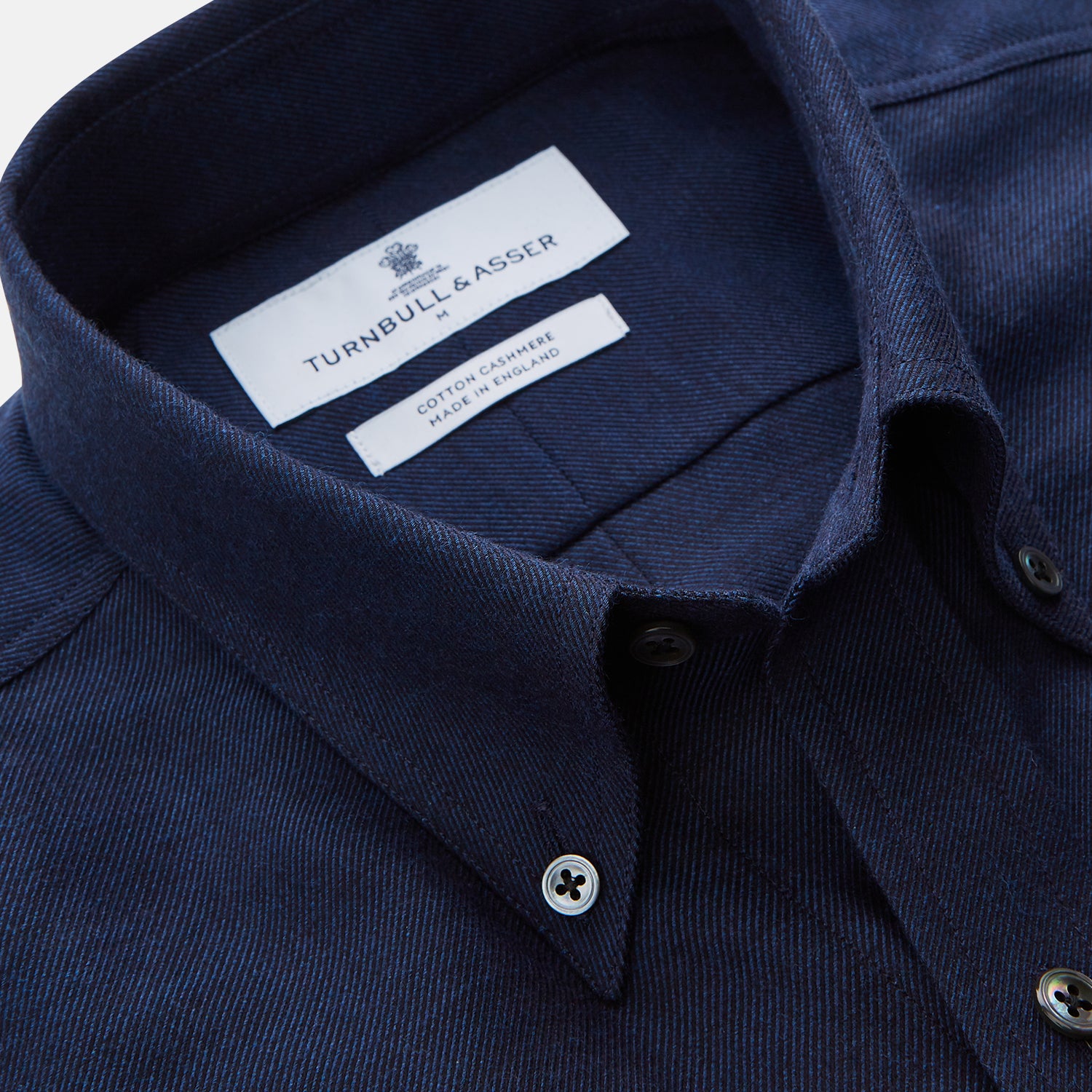 View 2 of product The Turnbull & Asser Navy Weekend Fit Nevis Cotton-Cashmere Shirt features a Dorset collar, 1-button cuffs, and is laid flat on a white background.