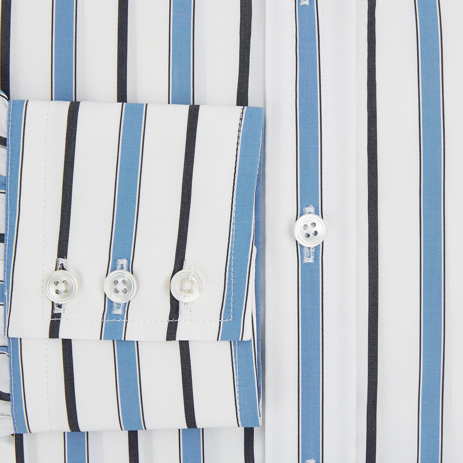 View 4 of product The Sky Blue Multi Candy Stripe Mayfair Shirt by Turnbull & Asser features vertical blue, black, and white stripes, a pointed collar, matching cuffs, and showcases signature British craftsmanship.
