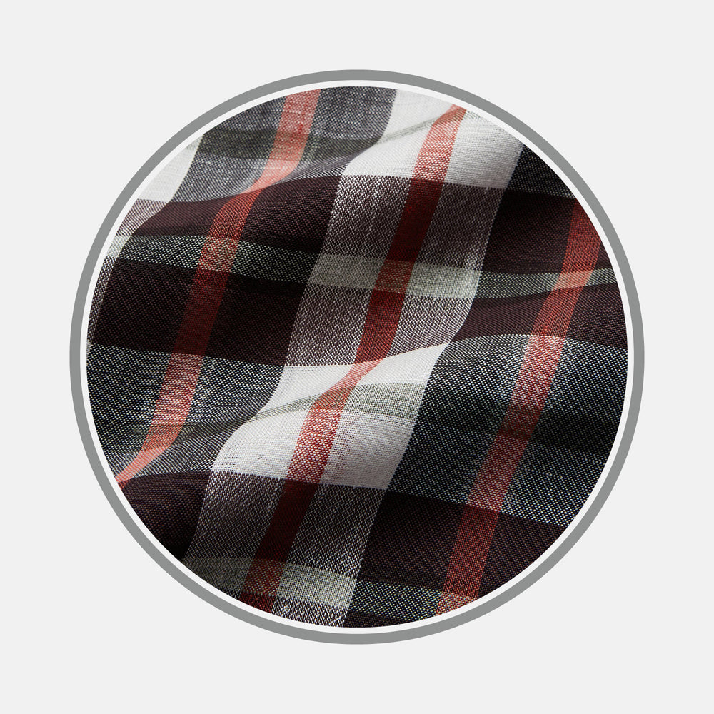 A close-up of Turnbull & Asser's Black and Red Check Linen Blend Fabric shows softly wrinkled plaid with black, white, and red intersecting stripes in a checkered pattern, framed by a circular gray border.