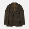 View 1 of product The Green Multi Check Cashmere Barrington Blazer by Turnbull & Asser, featuring a single-breasted design, notched lapel, and two front flap pockets, is shown laid flat on a white background.