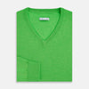 View 4 of product The Turnbull & Asser Lime Green Fine Merino V-Neck Jumper features ribbed cuffs and hem—a vibrant, standout knitwear choice for any wardrobe.