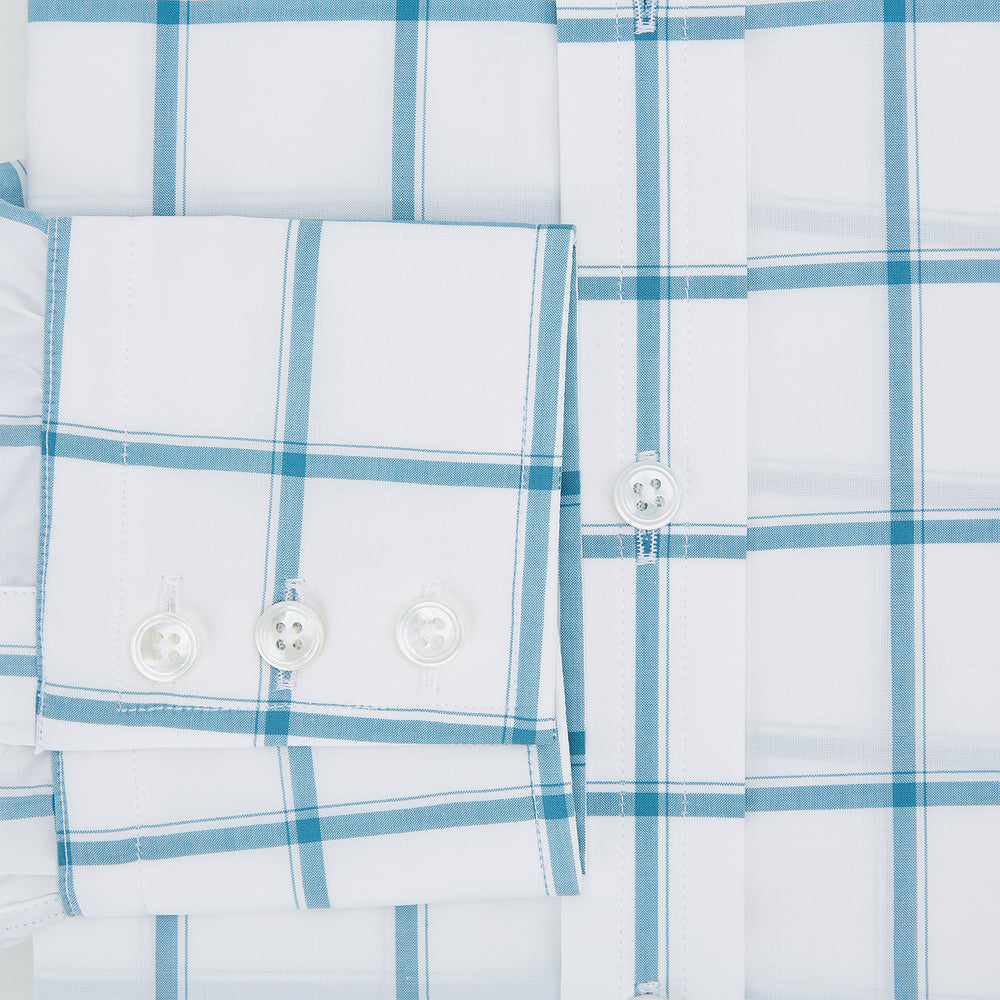 The Turnbull & Asser Turquoise Grid Check Mayfair Shirt is crafted from Italian cotton with a white base and turquoise grid pattern, featuring long sleeves, a pointed collar, and buttoned cuffs.