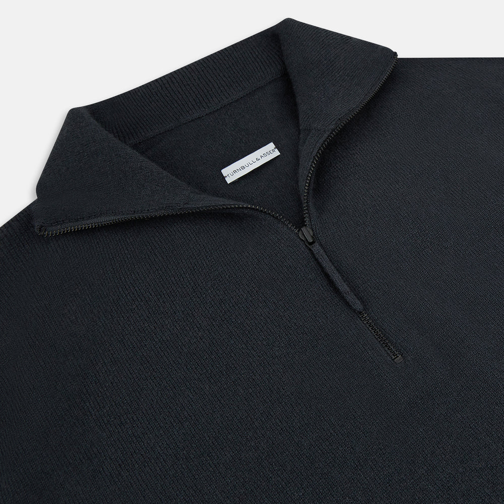 The Turnbull & Asser Smoke Grey Half-Zip Cashmere Jumper features long sleeves, a high collar, and a half-zip design, displayed against a plain white background.