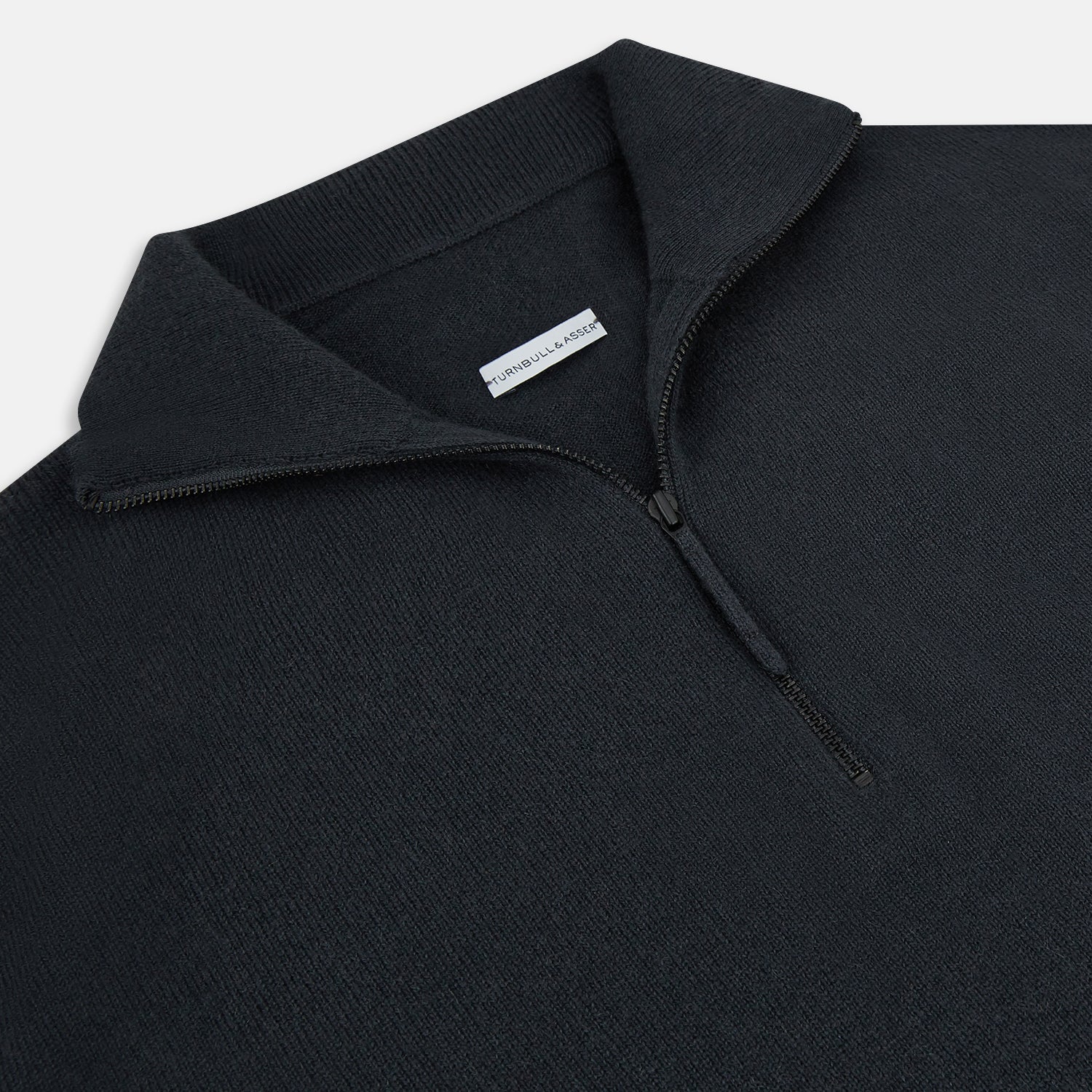 View 2 of product The Turnbull & Asser Smoke Grey Half-Zip Cashmere Jumper features long sleeves, a high collar, and a half-zip design, displayed against a plain white background.