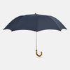 View 1 of product The Turnbull & Asser Navy Telescopic Umbrella with Whangee Crook Handle, featuring a silver shaft, is a refined men's accessory, shown open against a plain white background.