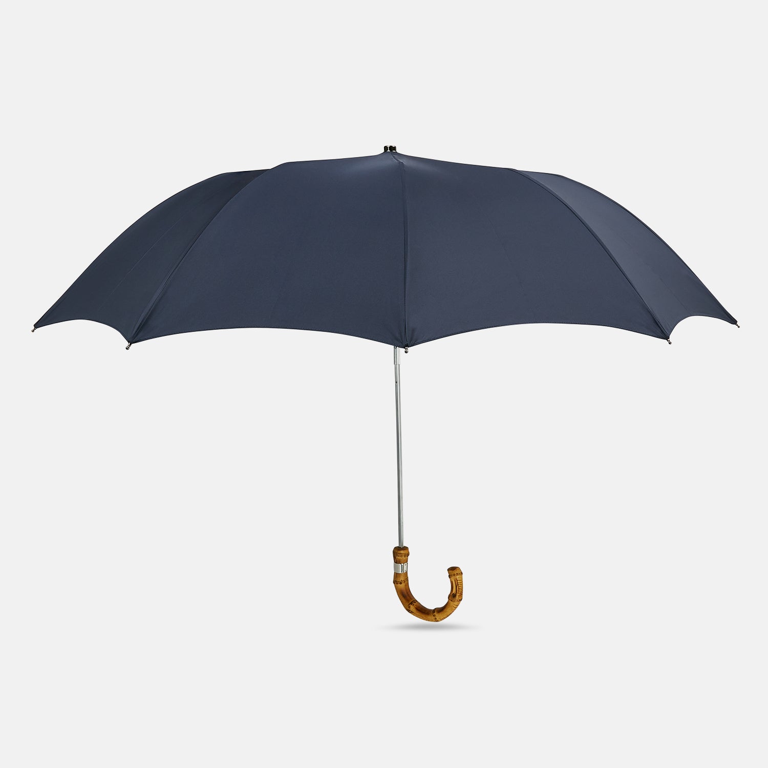 View 1 of product The Turnbull & Asser Navy Telescopic Umbrella with Whangee Crook Handle, featuring a silver shaft, is a refined men's accessory, shown open against a plain white background.