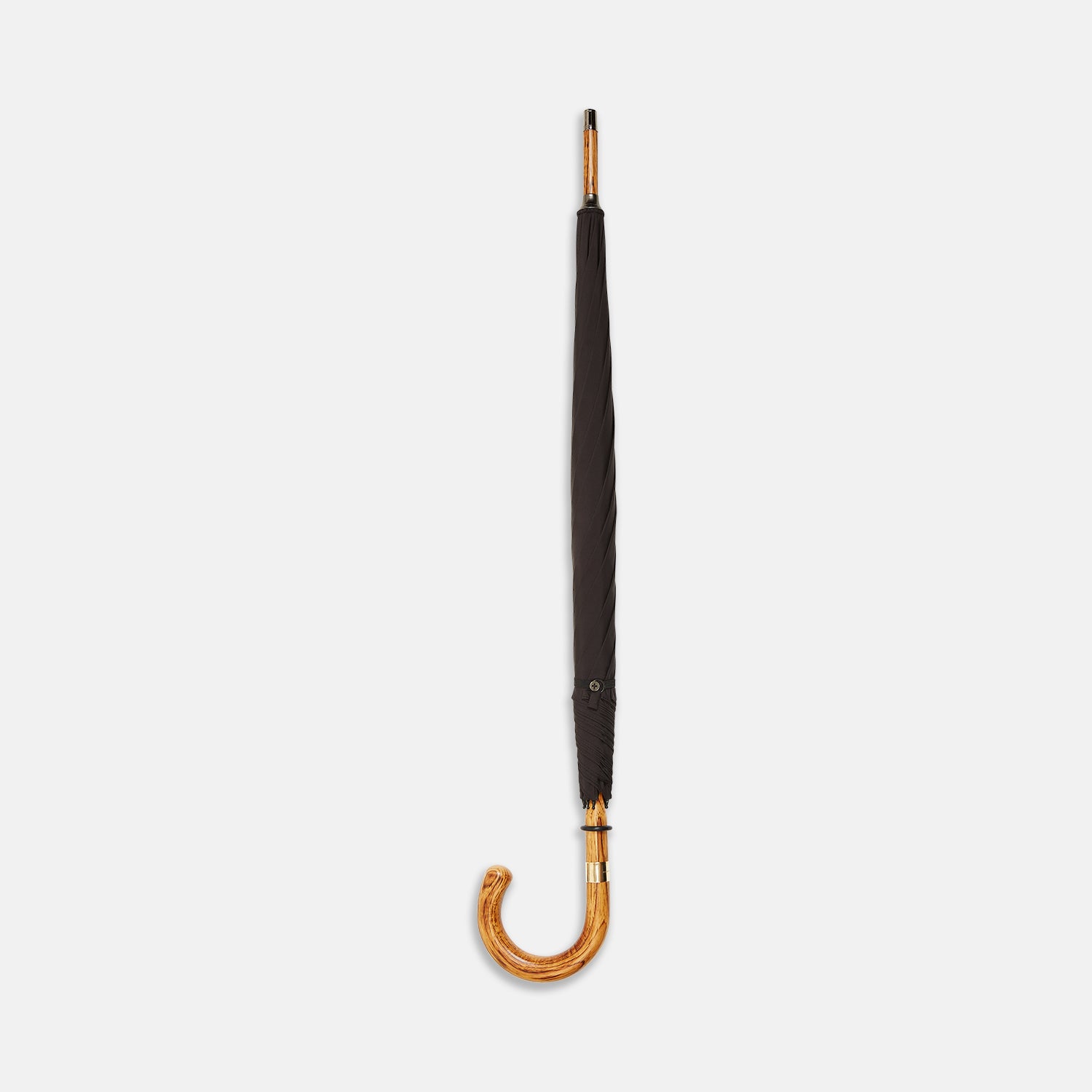 View 2 of product A Black Telescopic Umbrella by Turnbull & Asser with a curved maple handle and shaft, open and angled against a plain white background.