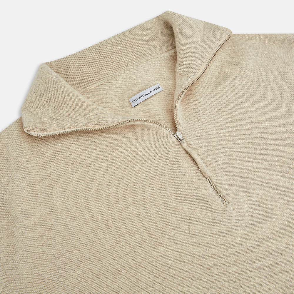The Turnbull & Asser Cream Half-Zip Cashmere Jumper is a beige, long-sleeve pullover with a high collar, showcasing timeless knitwear style against a plain white background.