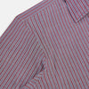 View 6 of product The Turnbull & Asser Wine Ticking Stripe Westminster Shirt features red, blue, and white vertical pinstripes on white and is shown laid flat on a white surface.