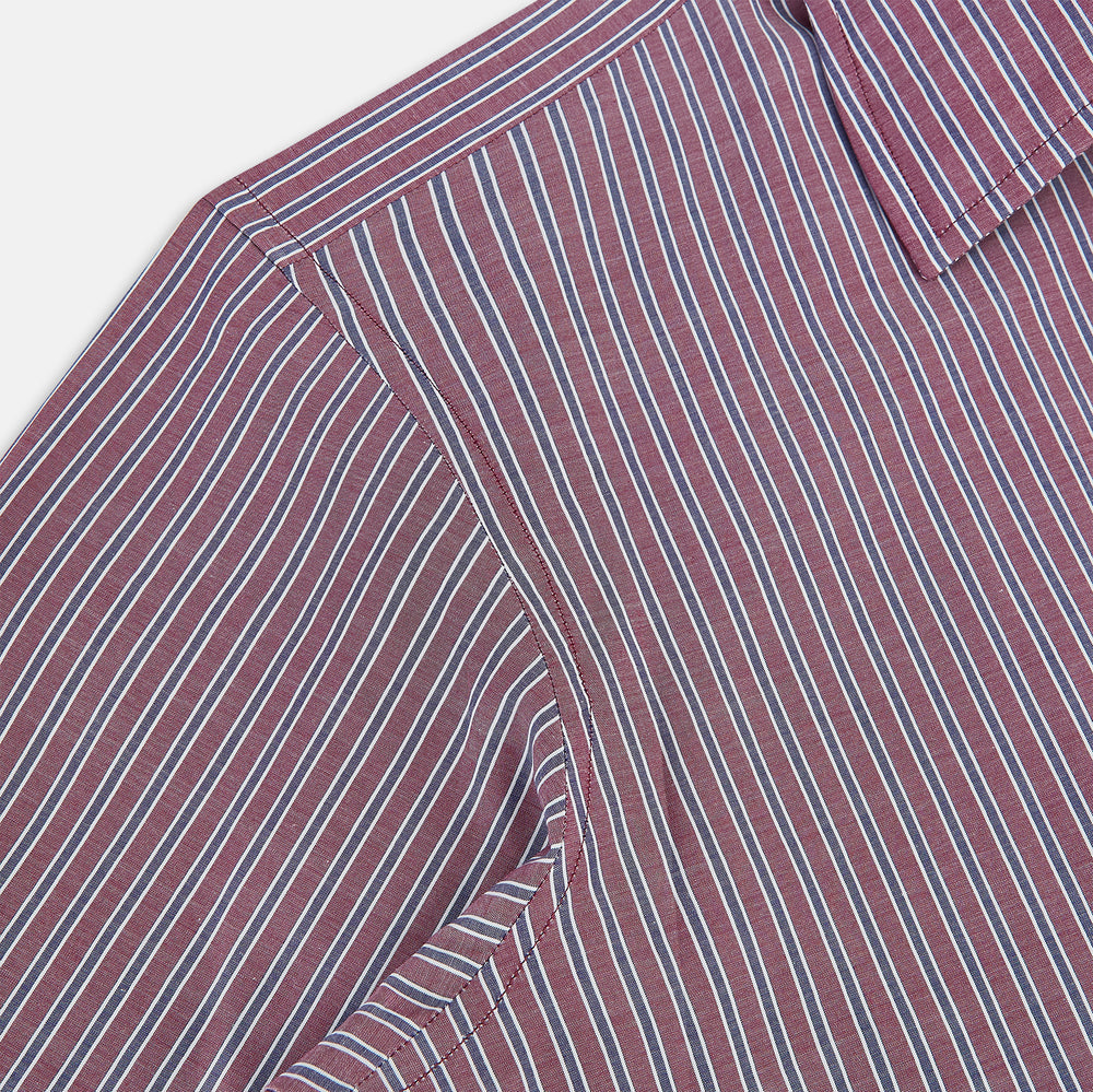The Turnbull & Asser Wine Ticking Stripe Westminster Shirt features red, blue, and white vertical pinstripes on white and is shown laid flat on a white surface.
