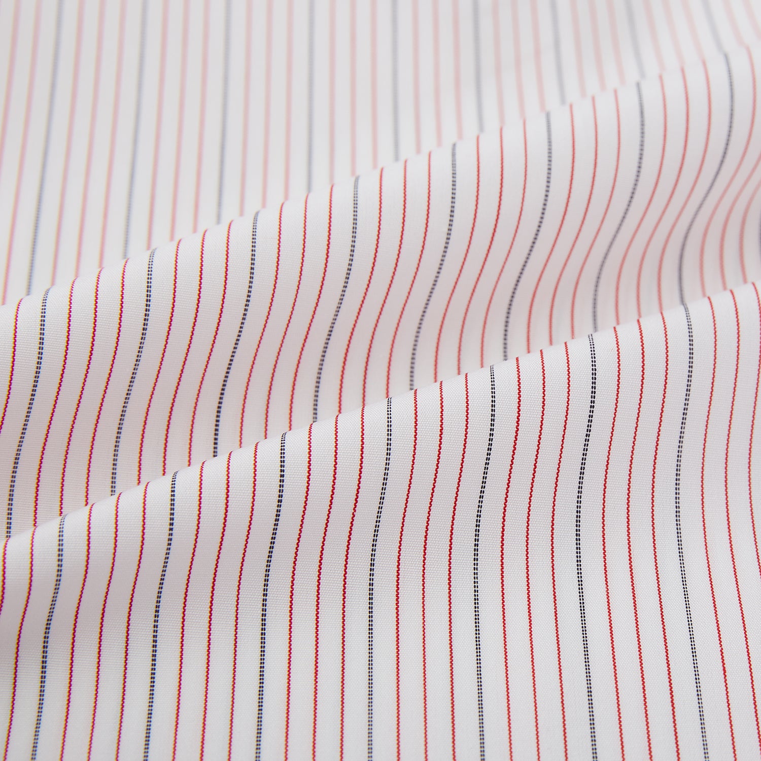 View 8 of product The Red Hairline Stripe Westminster Shirt by Turnbull & Asser features a pointed collar and thin vertical stripes in a light hue, displayed flat against a white background—a fine example of British craftsmanship.