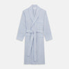 View 1 of product The Turnbull & Asser Blue and Yellow Check Poplin Cotton Dressing Gown features long sleeves, a shawl collar, front pockets, and a matching belt at the waist, shown on a plain white background.
