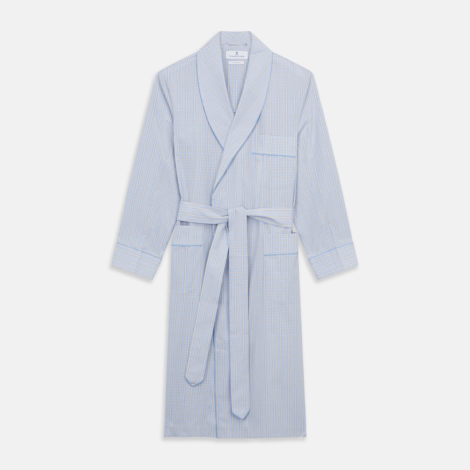 View 1 of product The Turnbull & Asser Blue and Yellow Check Poplin Cotton Dressing Gown features long sleeves, a shawl collar, front pockets, and a matching belt at the waist, shown on a plain white background.