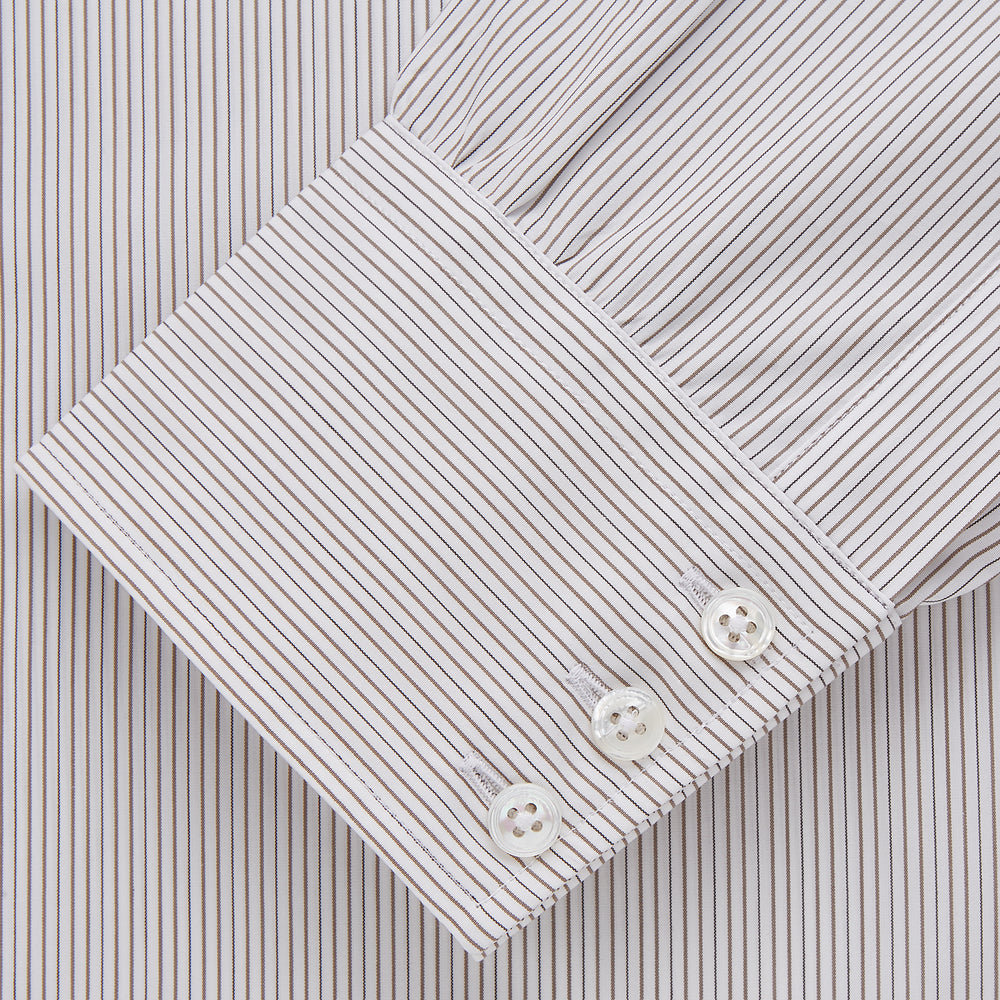 The Turnbull & Asser Sandstone Multi Stripe Cotton Regular Fit Mayfair Shirt, featuring long sleeves, button-up front, chest pocket, and classic collar with subtle white and light gray vertical pinstripes, is laid flat on a white background.
