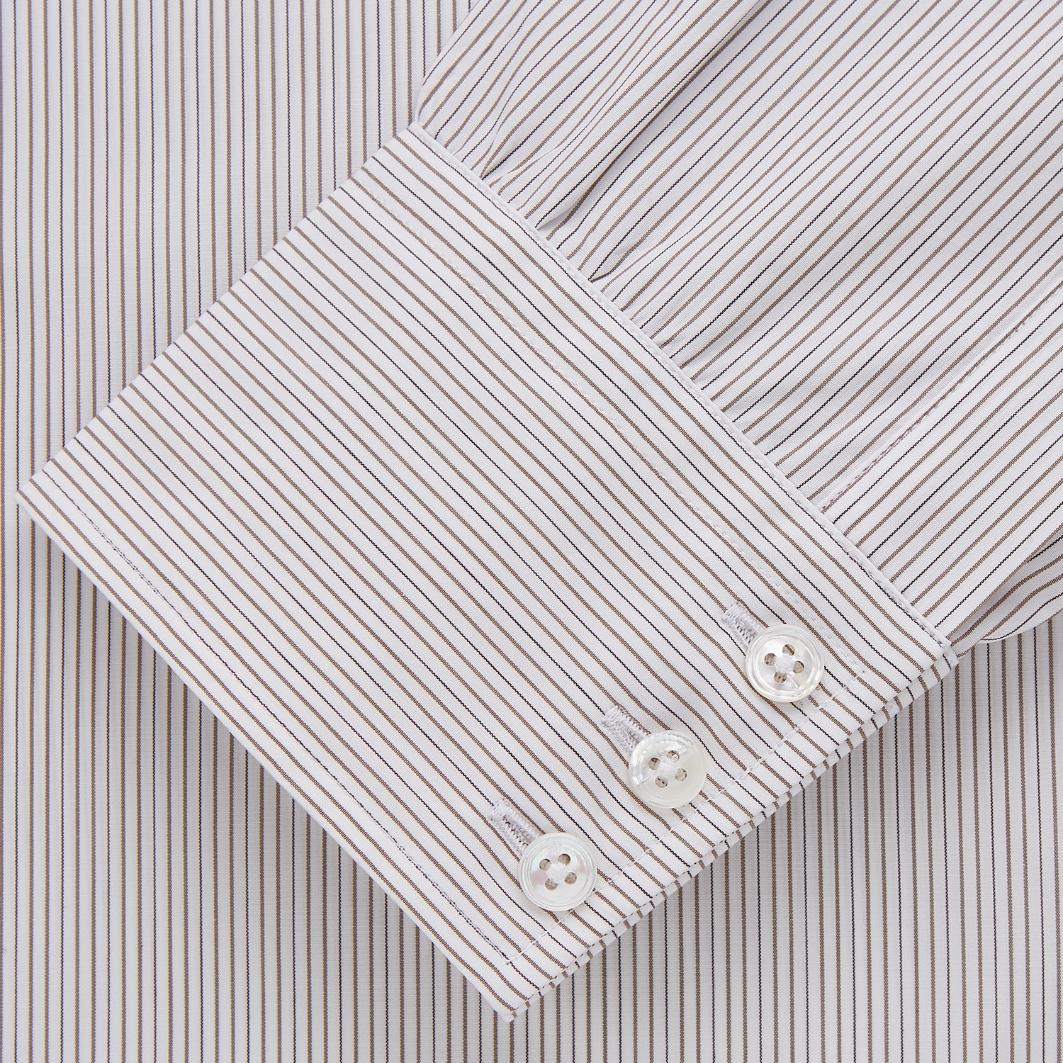 View 4 of product The Turnbull & Asser Sandstone Multi Stripe Cotton Regular Fit Mayfair Shirt, featuring long sleeves, button-up front, chest pocket, and classic collar with subtle white and light gray vertical pinstripes, is laid flat on a white background.