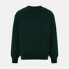 View 3 of product The Turnbull & Asser Forest Green Fine Merino V-Neck Jumper features long sleeves, ribbed cuffs and hem—classic knitwear for any wardrobe, shown on a white background.