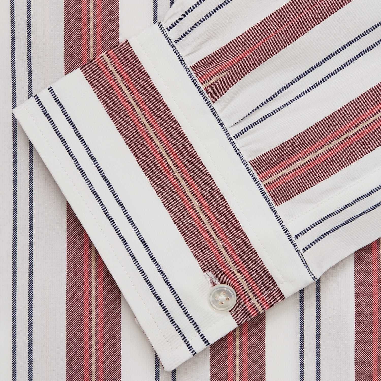 View 5 of product The Turnbull & Asser Red, Blue & White Stripe Weekend Fit Shirt features a Derby collar, 1-button cuffs, and crisp stripes—ideal for stylish winter layering.
