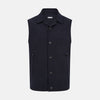 View 1 of product The Turnbull & Asser Navy Collared Single-breasted Waistcoat features a sleeveless design, wool-cashmere blend, two zippered side pockets, and a chest pocket—ideal for upgrading your winter look—shown on a white background.