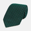 View 1 of product The Turnbull & Asser Dark Green Micro Dot Silk Tie features a refined pattern of light blue micro dots, making it the perfect accessory for any occasion.