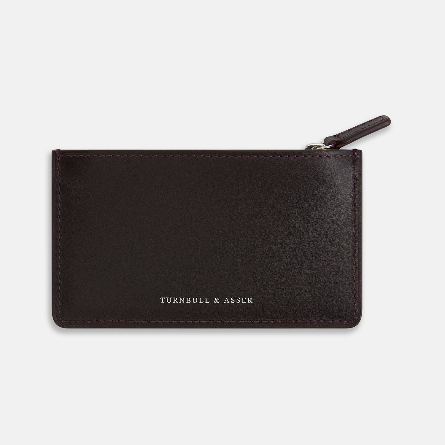 View 1 of product A Burgundy Leather Zip Wallet by Turnbull & Asser, featuring the brand's white logo near the bottom center, displayed on a plain white background.