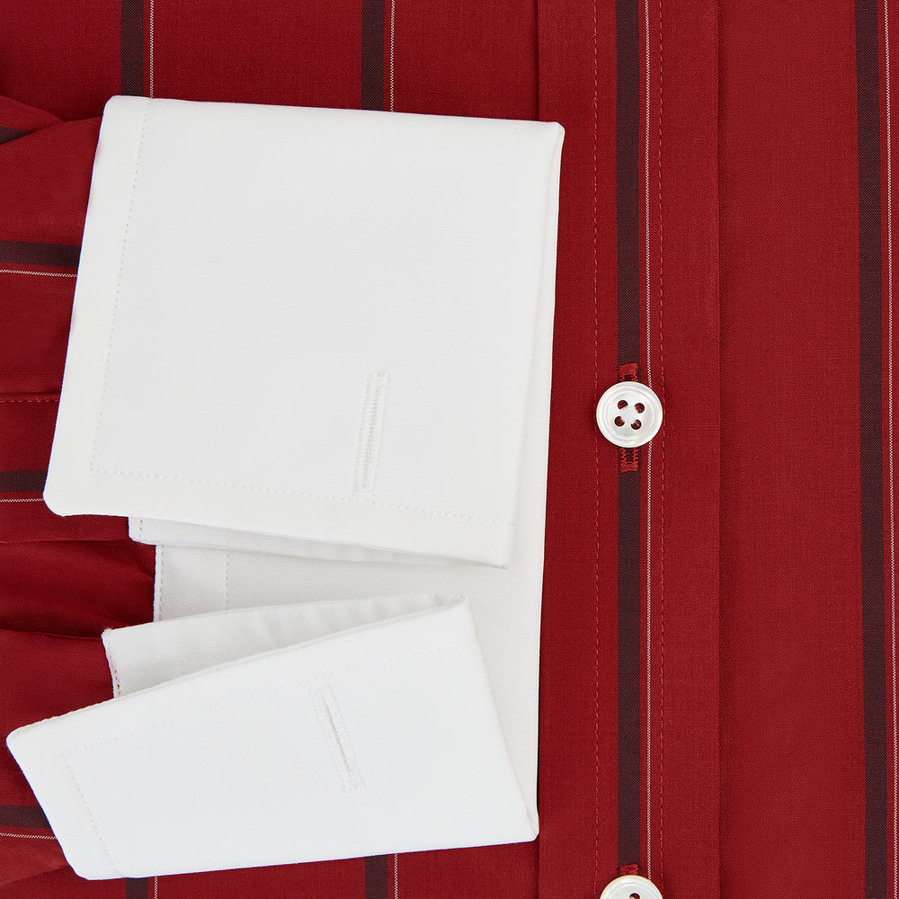 The Turnbull & Asser Dark Red Track Stripe Shirt with Contrast T&A Collar and Cuffs features vertical black stripes, a white collar and cuffs, Mayfair fit, and fine British craftsmanship, shown laid flat on a plain background.